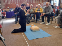 Woman teaching first aid